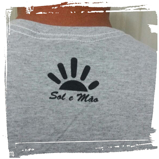 camisa ilha grande sol e mão marca costas